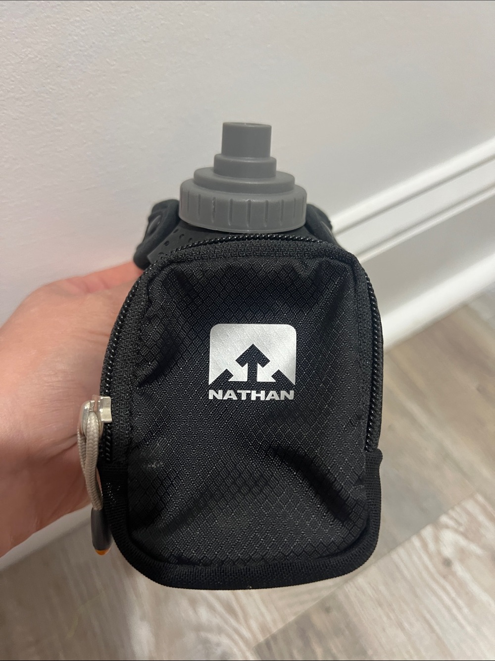 Nathan Black Handheld Hydration Bottle with Front Pocket